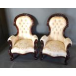 A Pair Of Victorian Style Drawing Room Armchairs, each with a carved and button upholstered back
