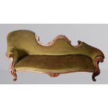 A Victorian rosewood serpentine chaise longe, with a carved shaped back and raised upon cabriole