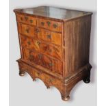 An 18th Century walnut chest on stand, the moulded top above two short and three long drawers with