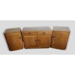 An Ercol Windsor standard wide cupboard with two drawers above two doors, 91cms wide, 44cms deep and
