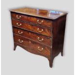 A 19th Century mahogany straight front chest of four long drawers raised upon outswept feet,