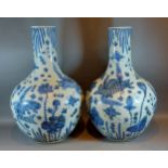 A pair of Chinese large under glaze blue decorated bottle neck vases, each decorated with fish