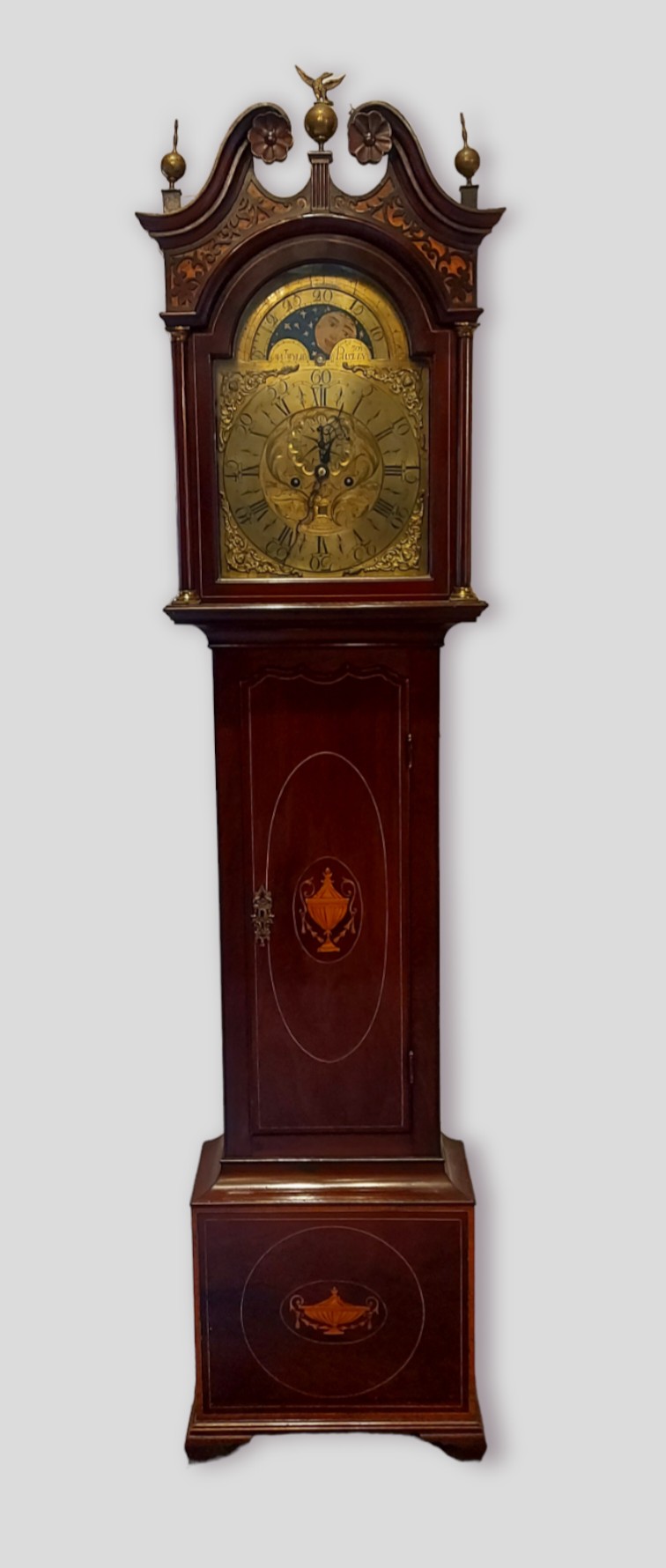 A 19th century mahogany long case clock, the arched hood with swan neck pediment and eagle finials