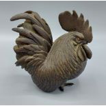 A Japanese Meiji period bronze cockerel with seal mark to underside, 13cm tall