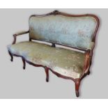 A French rosewood sofa, the shaped carved and upholstered back above a similar seat with carved