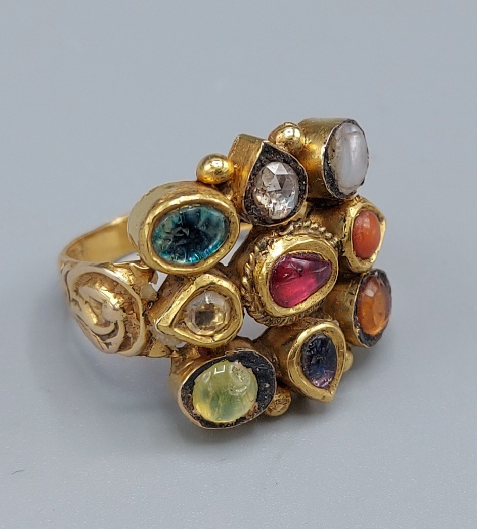 A Mughal yellow metal ring set with a single diamond and semi-precious stones, 10gms,