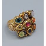 A Mughal yellow metal ring set with a single diamond and semi-precious stones, 10gms,