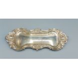 A William IV silver pen tray of shaped scroll form, Sheffield 1830, makers Samsom and Harwood,