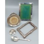 A Birmingham silver miniature Capstan inkwell together with three silver photograph frames and a