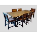 A 20th Century oak refectory style dining table together with a set of six leather and brass studded