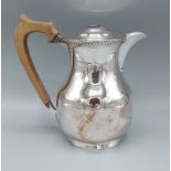 A Birmingham silver covered jug with shaped handle, 13ozs all in, 16cms tall