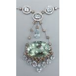 An 18ct white gold Diamond and Aquamarine necklace, the large oval stone with seven drops with