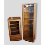 An Ercol Windsor bookcase with glazed door, 47cms wide, 31cms deep and 152cms tall together with