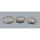 An 18ct gold five stone diamond ring together with two other gold rings, 4.2 grams