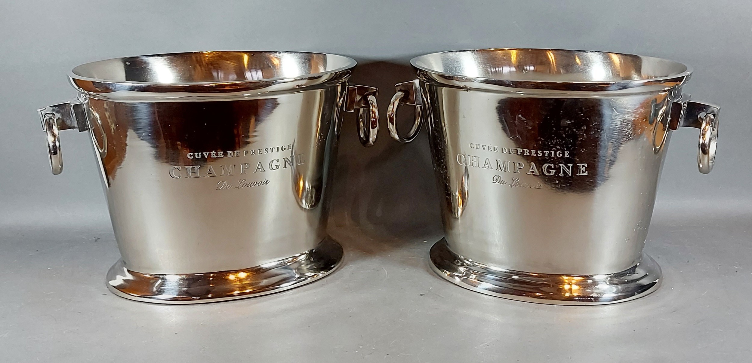 A pair of large oval Champagne coolers with circular ring side handles bearing inscription, 25cms