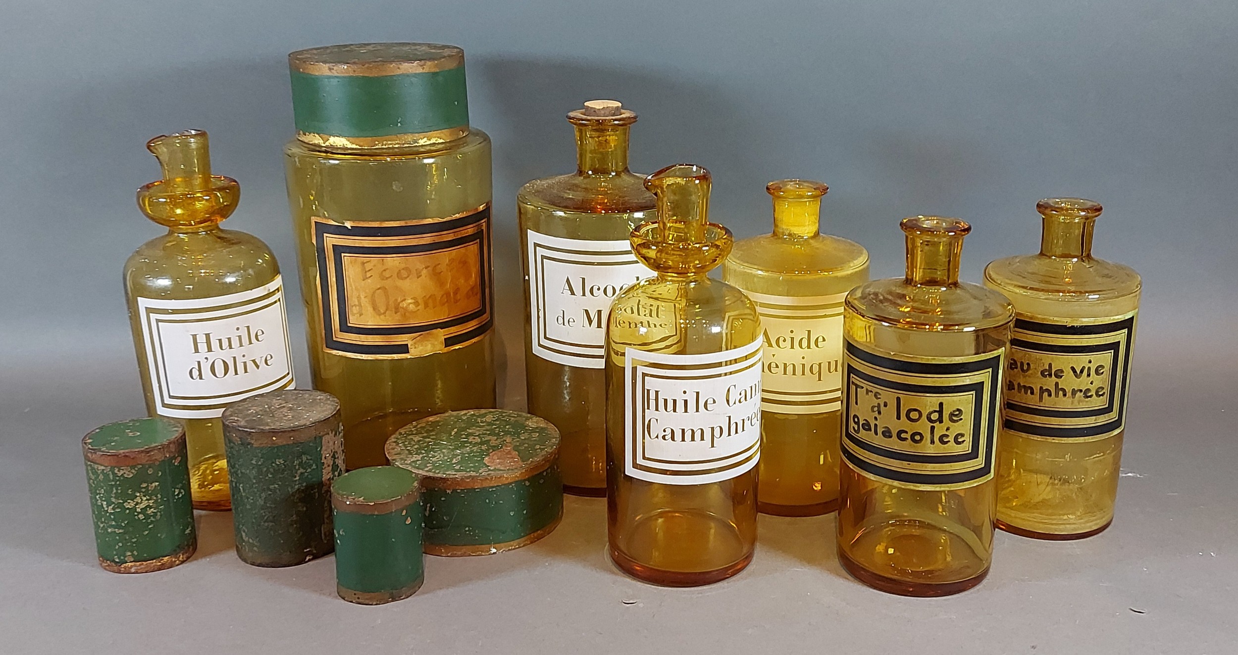 A collection of seven amber glass apothecary jars