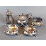 A pair of Victorian London silver salts together with a Chester silver three piece condiment set,