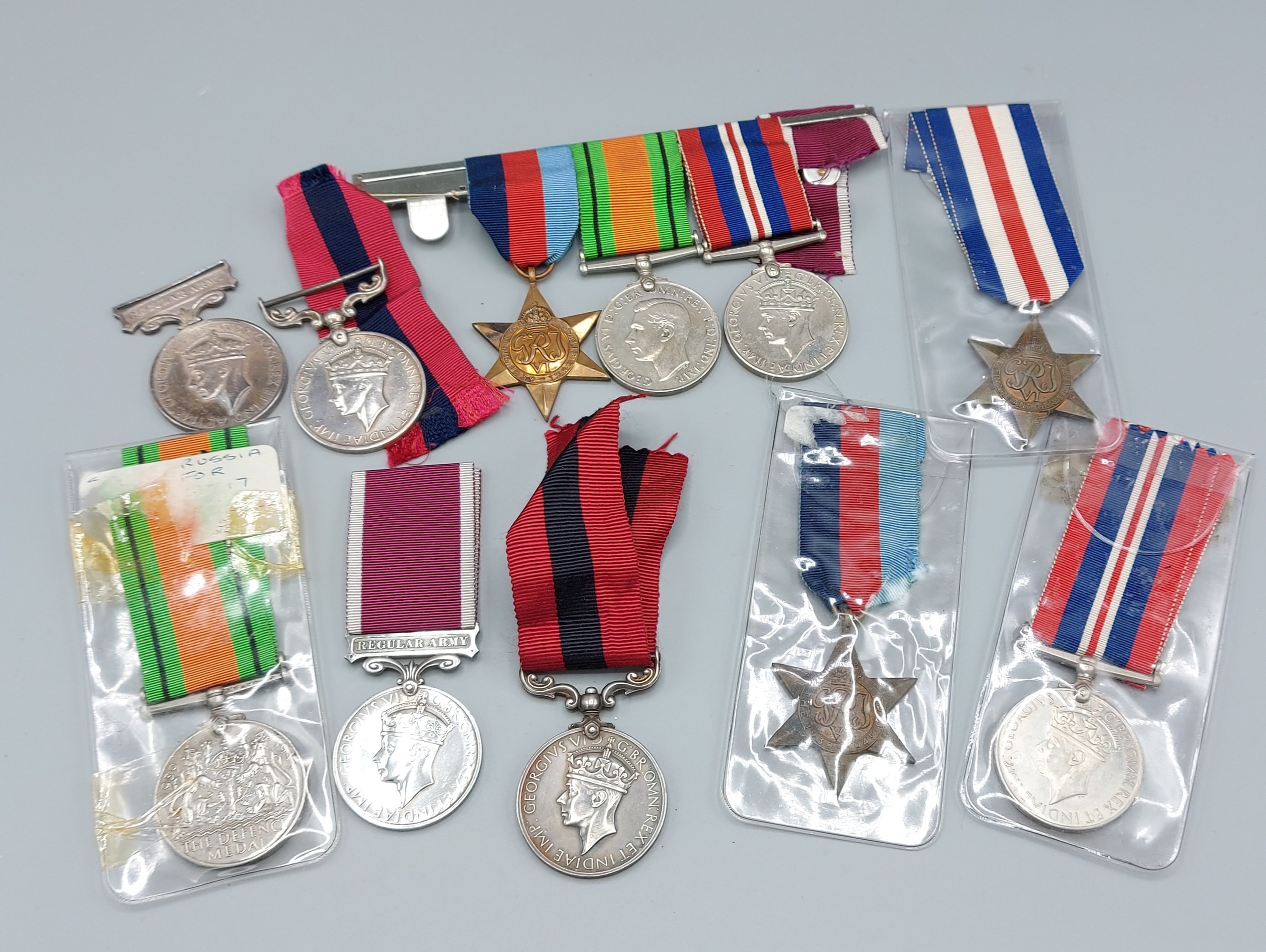 A collection of WWII medals to include Defence Medals, Stars, War Medals and others