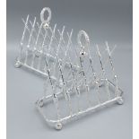 A pair of six division toast racks in the form of rifles