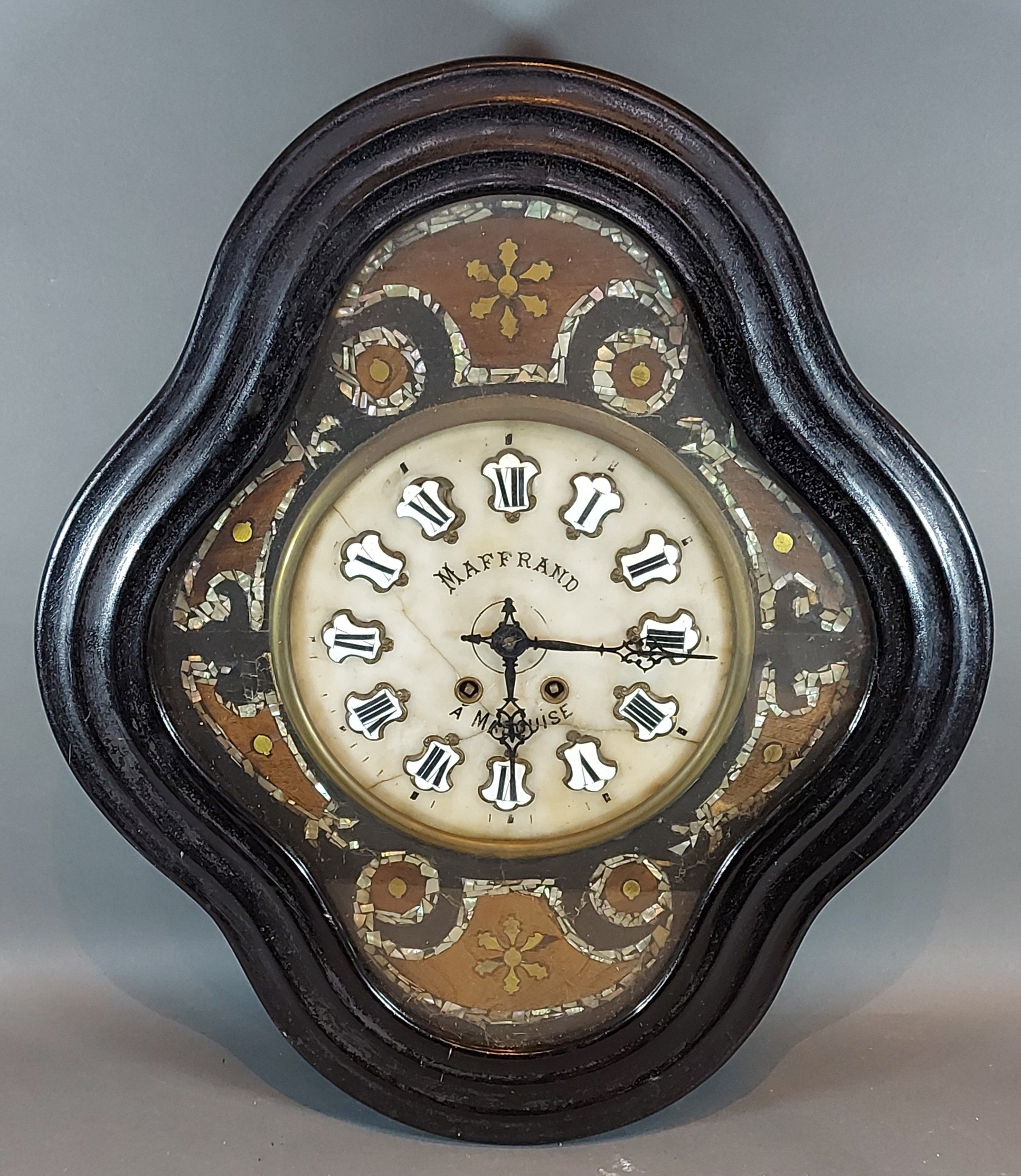 A 19th Century French ebonised vineyard wall clock, the alabaster dial named Maffrand, A Marquise