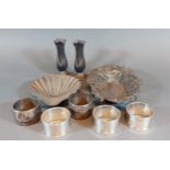 A pair of Chester silver spill vases together with a London silver butter dish of scallop form, a