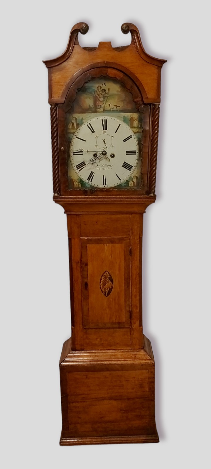 A 19th Century longcase clock, the arched hood with swan neck pdiment above a rectangular door and