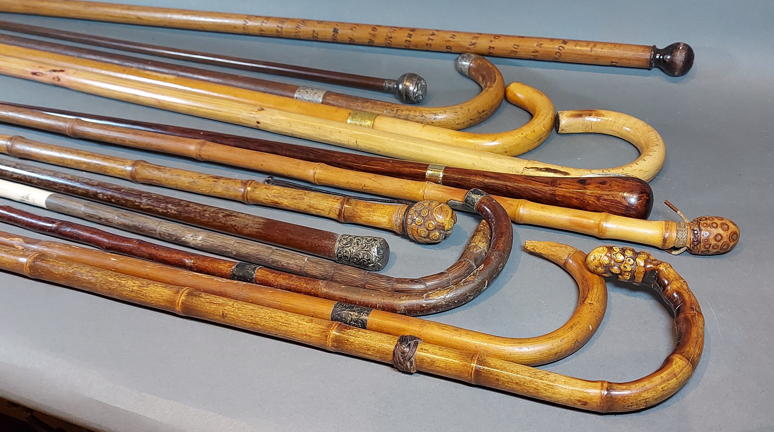 A 15ct gold mounted walking cane together with a collection of other canes, some with silver mounts - Image 2 of 3