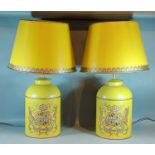 A pair of Toleware table lamps, each decorated with a gilded crest upon a Mustard groundand with