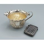 A Victorian small cream jug, Sheffield 1889 together with a Birmingham silver Vesta case of ribbed