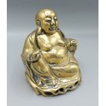 A 19th Century Chinese bronze figure in the form of Buddha, 17cms tall