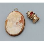 A 9ct gold charm in the form of a car, 6.1 grams together with a cameo brooch with 9ct gold frame