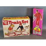 The Six Million Dollar Man within original box together with a Play Craft Toys Train Set 9510 within