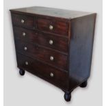 A 19th Century mahogany chest of two short and three long drawers with circular brass handles raised