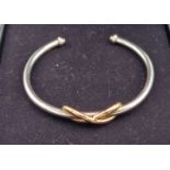 A Tiffany & Co 925 silver and 18ct gold Infinity cuff bangle, 12.5gms