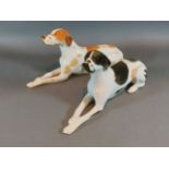A pair of USSR porcelain seated Pointer dogs, 29cm long
