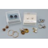 A pair of 9ct gold citrine set earrings, together with six sets of earrings and ear studs