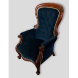 A Victorian mahogany drawing room armchair, with buttoned upholster back and scroll arms raised upon