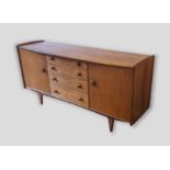 A hardwood sideboard designed by John Herbert for A. Younger with four central drawers flanked by