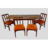 An extending dining table designed by John Herbert for A. Younger with single drop flap top raised