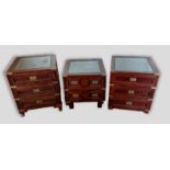 An oriental hardwood campaign style chest of three drawers with sunken brass handles, 56cm wide by