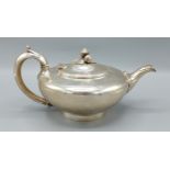 A Victorian silver teapot of circular form, London 1840, marker mark W.M, 26ozs, 13cms tall