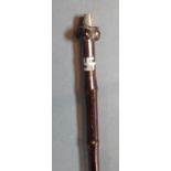 An African tribal staff with white metal mounts, 126cms long