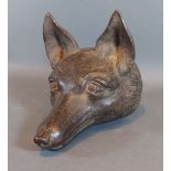 A cast iron door stop in the form of a foxes head