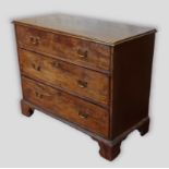 A 19th Century mahogany straight front chest, the moulded top above three long drawers with brass