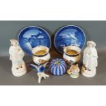 A pair of Royal Worcester squat vases each hand painted with birds, number 1651, together with a
