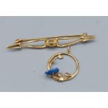 An 18ct gold bar brooch, 5gms together with a yellow metal pendant,1.9gms