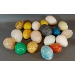 A collection of stone hand warmers in the form of eggs