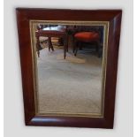 A 19th Century Rosewood rectangular wall mirror with gilt inner slip, 99cms x 75cms