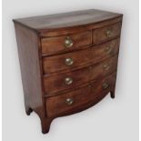 A 19th Century mahogany bow fronted chest, the reeded top above two short and three long drawers