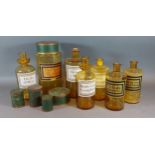 A collection of seven amber glass apothecary jars